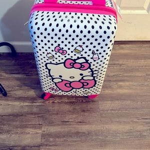 Hello kitty carry on suitcase.Polka dots black and white.
